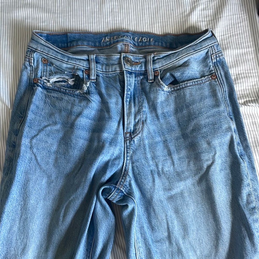 Jeans from AE 90s bootcut, size 28 has a light wash.